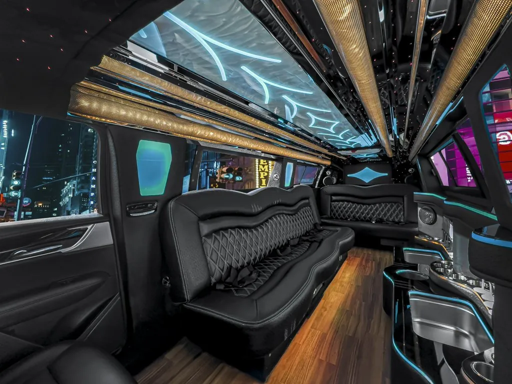 image of 14 passenger Cadillac XT6 limousine interior view from rear passenger side captain chair