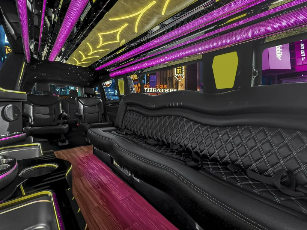 image of 14 passenger Cadillac XT6 limousine view of side bench, rear captain seats and rear bench seat