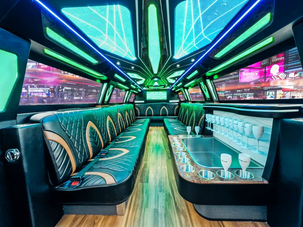image of 16 passenger GMC Sierra stretched limousine interior view from front row rear bench seat