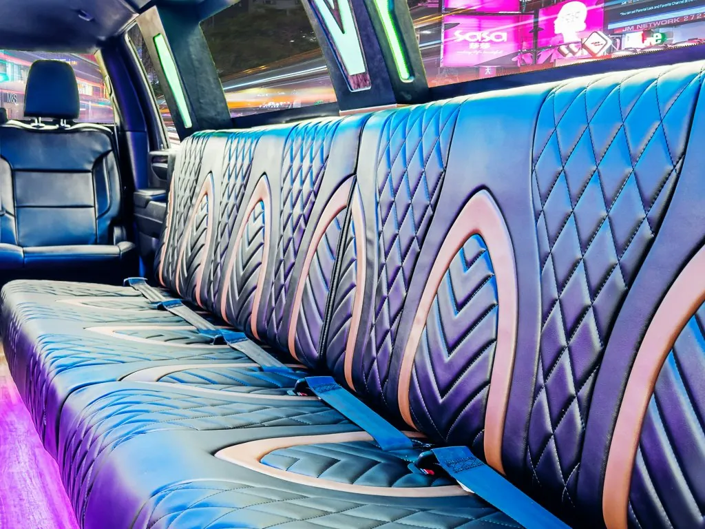 image of 16 passenger GMC Sierra stretched limousine interior view of driver side bench seat