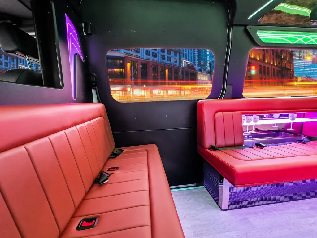 image of 20 passenger party bus interior front bench and passenger side window taken from driver side front bench