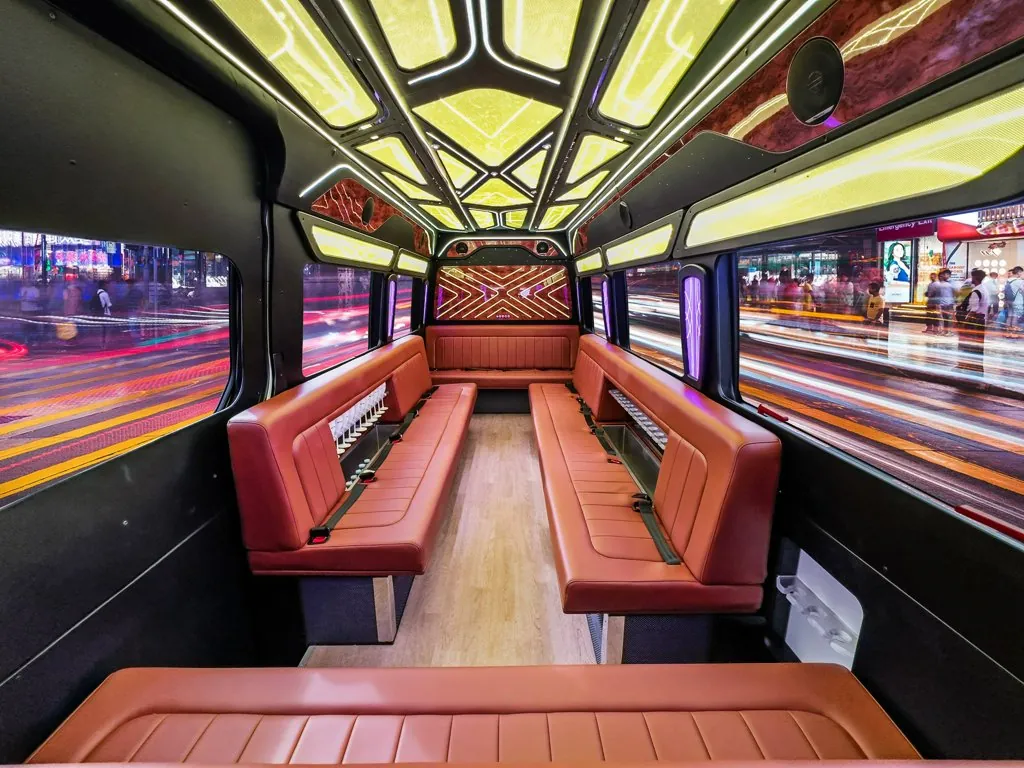 image of 20 passenger party bus lit interior taken from front entryway