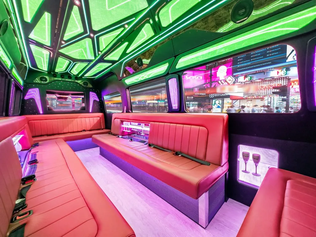 image of 20 passenger party bus lit interior taken from rear driver side corner