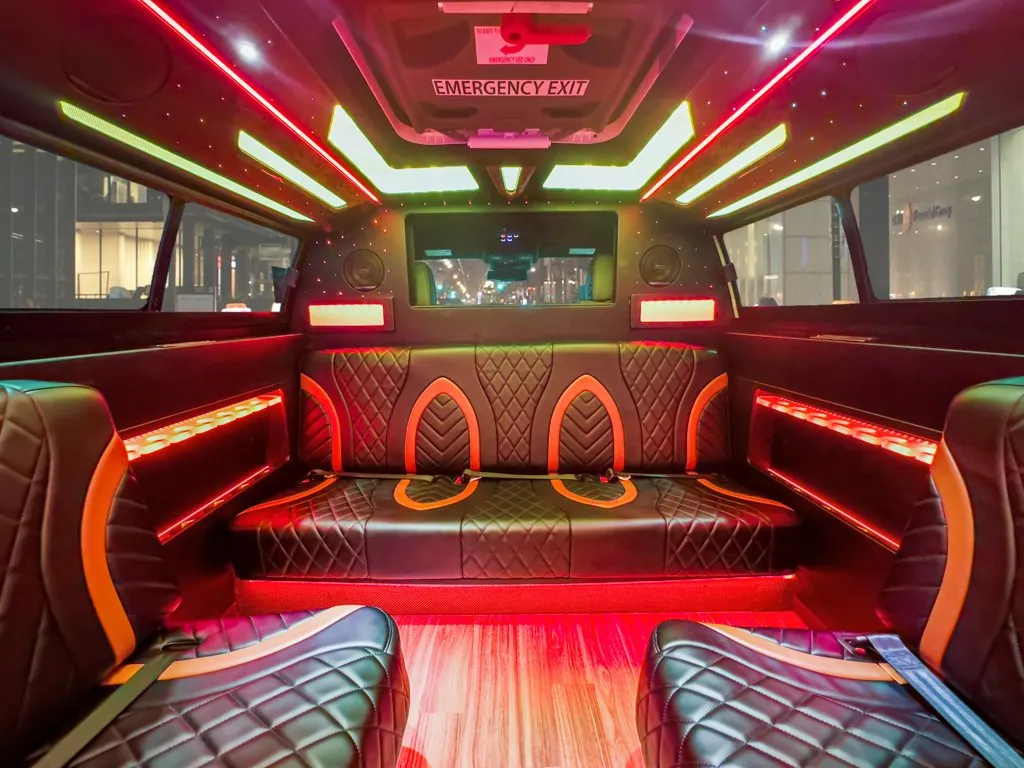 image of 20 passenger Cadillac Escalade stretched limousine interior front bench seat from middle