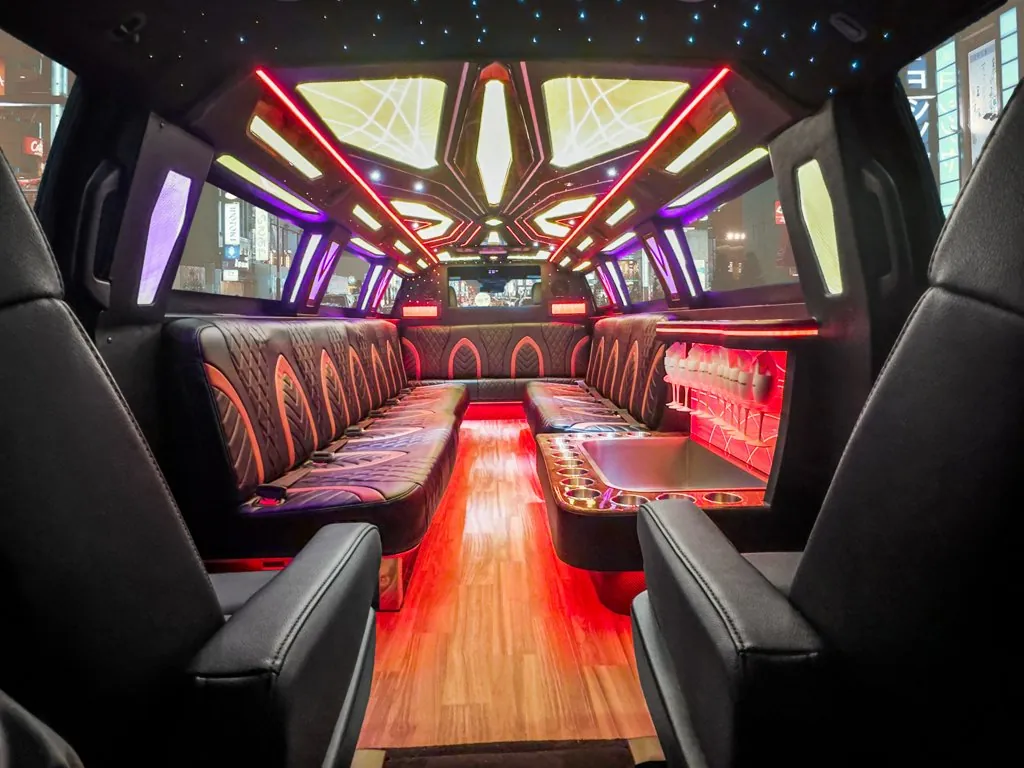 image of 20 passenger Cadillac Escalade stretched limousine interior taken from center of back bench seat