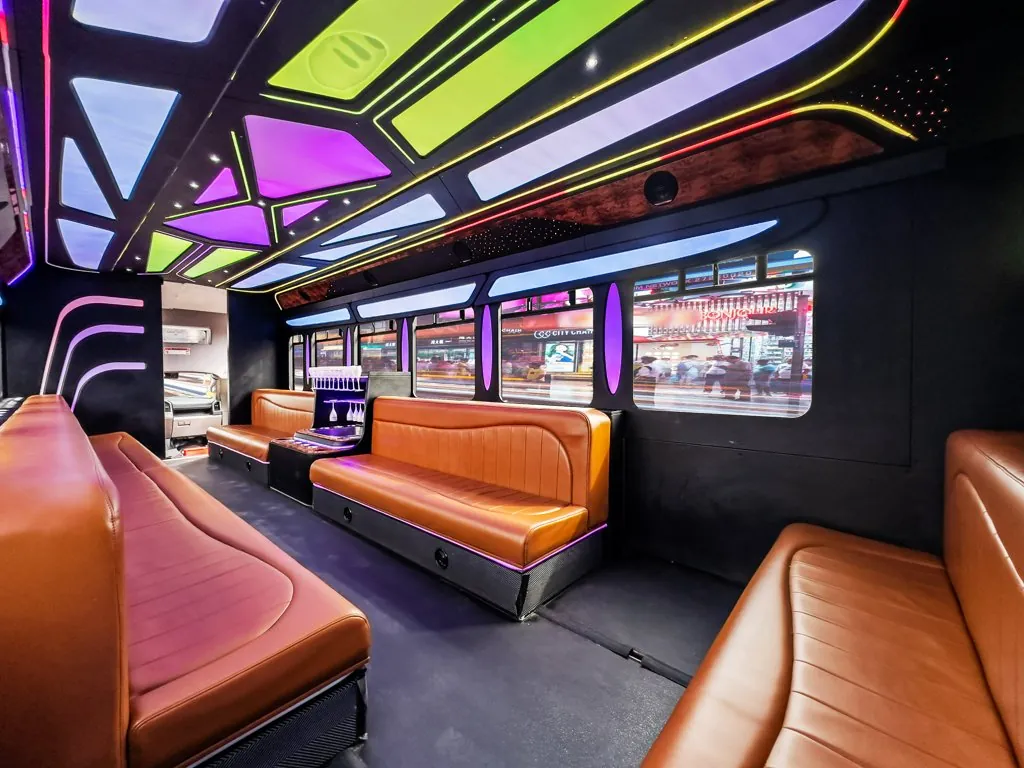 image of 28 passenger Party Bus lit interior taken from rear driver side corner